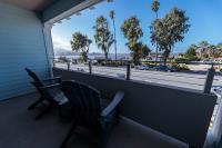 Glass wall opens to outside view deck.