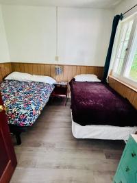Bedroom with full size bed and twin bed
