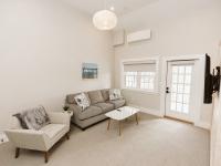 Image shows Living room with Couch, Chair, TV