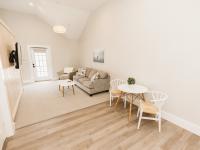 Image shows living room and Table and Chairs