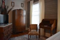 Antique wardrobe, rolltop desk, and SmartTV